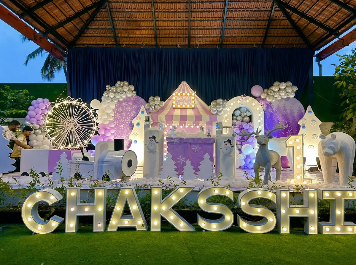 Winter carnival birthday setup with marquee letters and ferris wheel